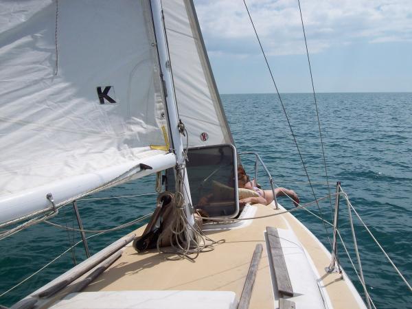 Nauti One's new owner relaxing on the foredeck