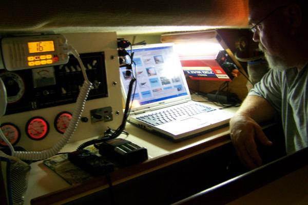 Nav station of AQUILA is within the portside passage way just aft of the galley. Nav table slides out opening to the top of the engine compartment.