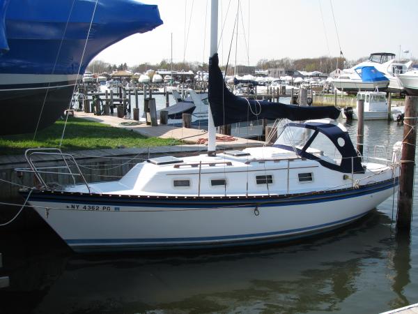 new decals, paint and hull bleached compounded and waxed. 1st year of restoration.