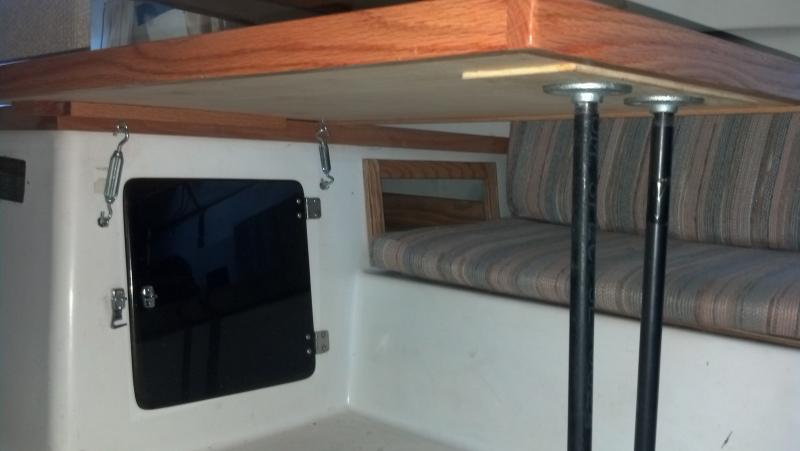 new galley table is secured by turn buckles and threaded pipe for legs