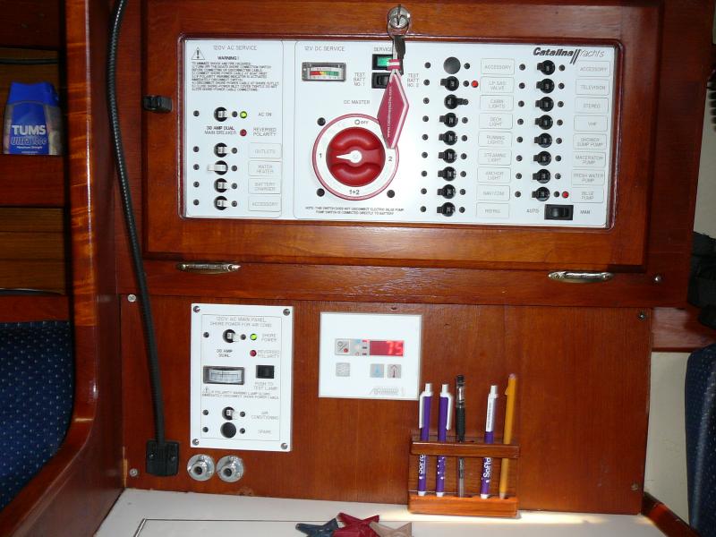 New Seaward Electrical panel including separate HVAC breaker. Notice the MarineAir thermostat. Now to right of pens, is the Xantrex inverter panel.