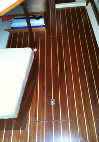New teak and holly cabin sole.  Modified access cover to bilge.