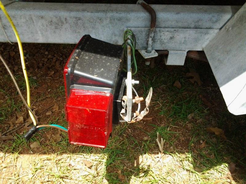 Old tail light was so rusted that the bolt was stuck. Had to place the new light over it for the ride home. Hack sawed it off and remounted the light.