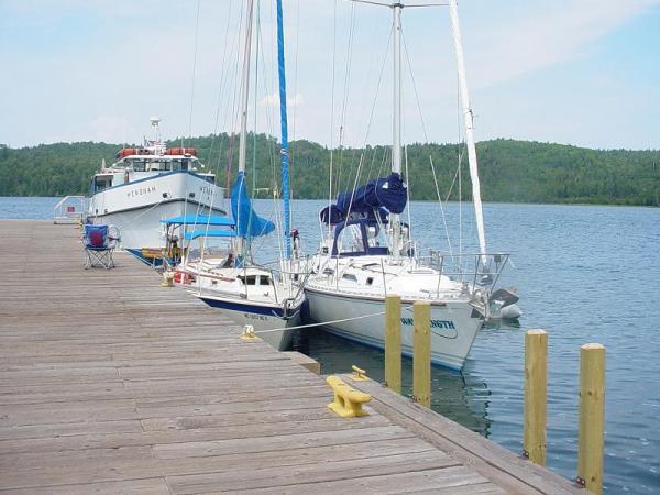 On the west end of Isle Royale, in Windigo harbor. The Wenona is a passenger boat that travels from Grand Portage Mn. The sail boat that was tied behind me rafted along side while the Wenona let off passengers.