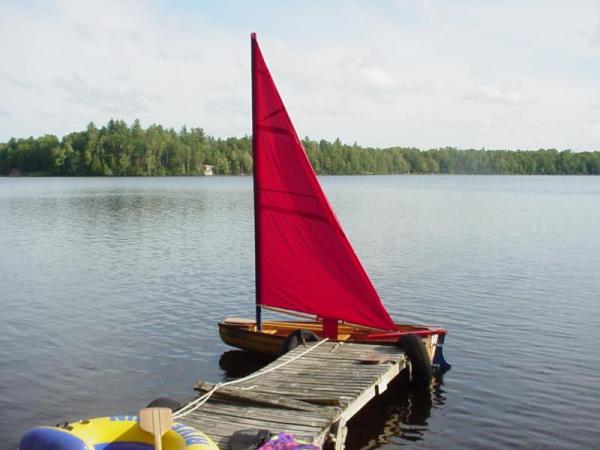 Our dinghy on an inland lake with the sail rig up. It is not a fast outfit but fun to play with.