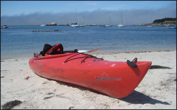 Our first boats, A pair of Perception kayaks, on the beach at Stillwater Cove, Pebble Beach, CA