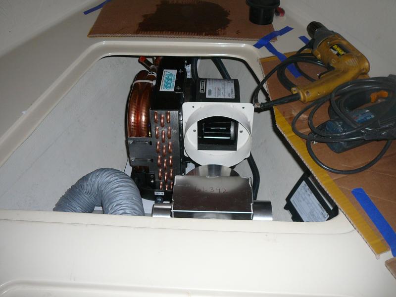 Placed HVAC in V-berth. Glassed a shelf between anchor locker and secondary fresh water tank. Notice plenum to be installed.  Also install Venturi System to remove condensation from interior of boat | bilge.  Sound abatement keeps it quiet in V-berth.