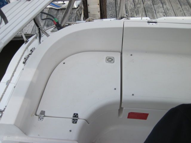 Port locker that gains access to back side of shore power connectors