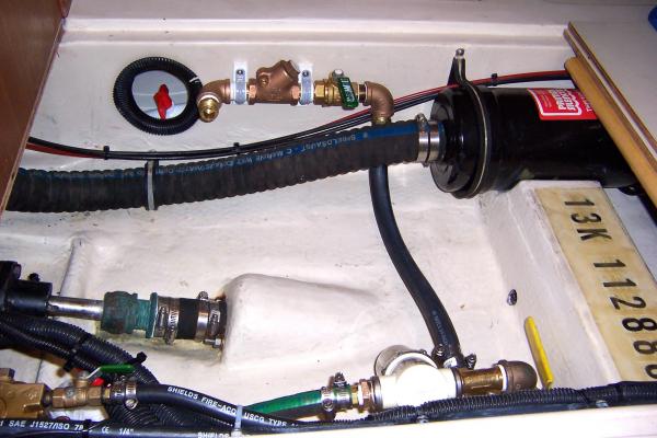 Raw water intake showing auxiliary pump suction to engine raw water pump.  For those days when the bilge pump just isn't quite enough to keep your sox dry.
