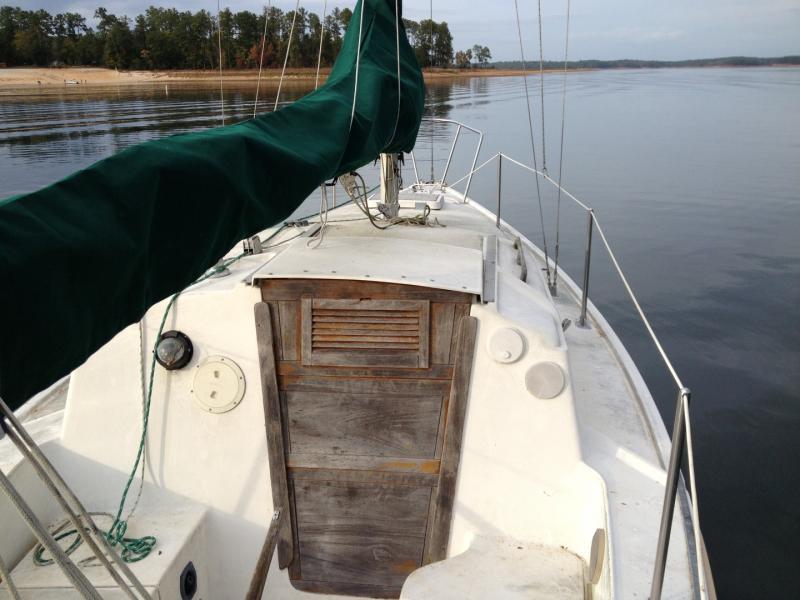 Really nice companionway doors, but they all need to be reassembled. The boards all separated from warpage and sun damage. It looks like he assembled them with regular wood glue. We're going to use epoxy this time.
Brand new canvas sail covers and jib bags also came with the boat.