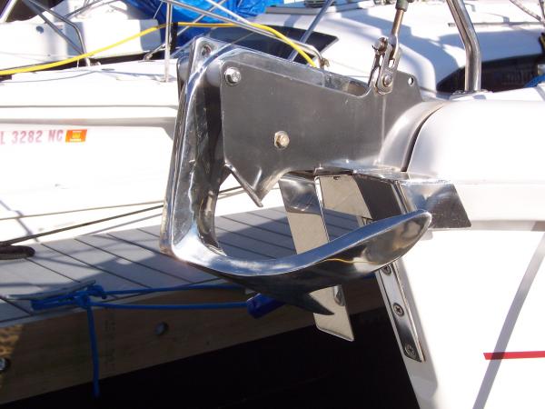 Recently installed 15 kg. SS claw anchor.  Boat anchor mount was originally intended for a Danforth.  SS plate just aft of the anchor prevents the anchor from hitting the bow when deployed.