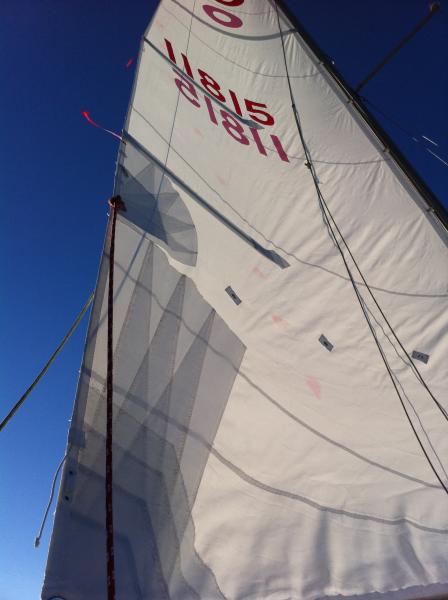 Red sail ties from West Marine can bleed onto sails - we no longer leave them on when sailcover is on.