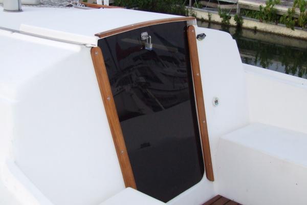 Refinished mahagony companionway trim.