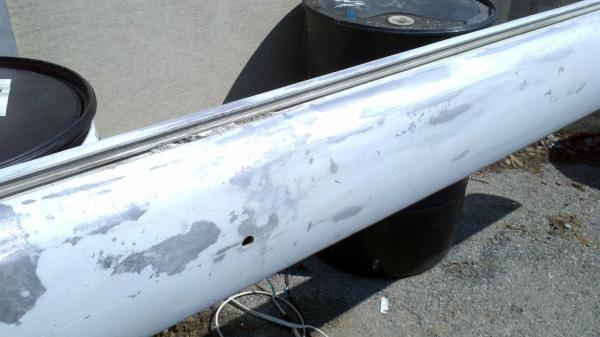 Result of trucking the mast without padding under the wire.