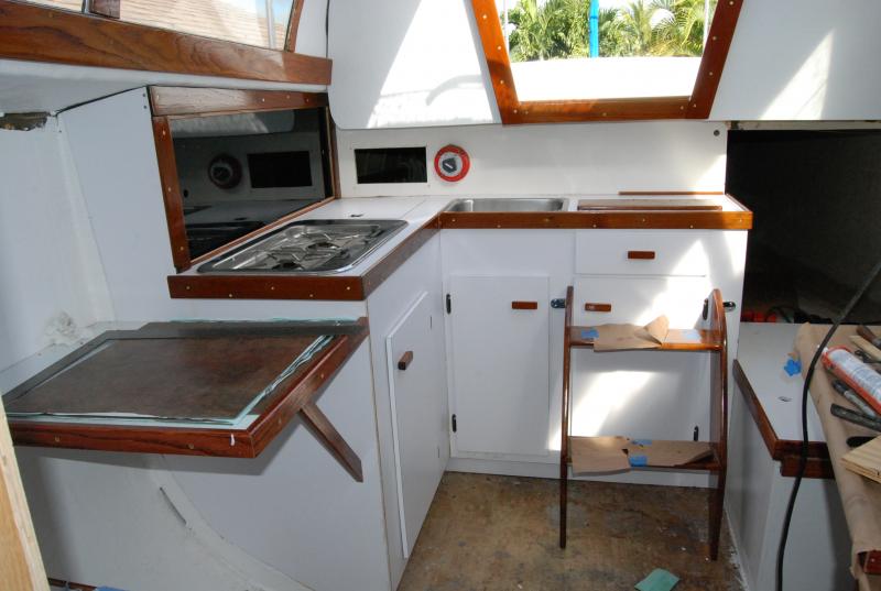 Resurfaced the Galley with new formica and rebuilt the counter top. The stove is new and it was a little large so I had to build the counter top out few inches to accommodate. All the teak was refinished with Minnie wax tung oil.