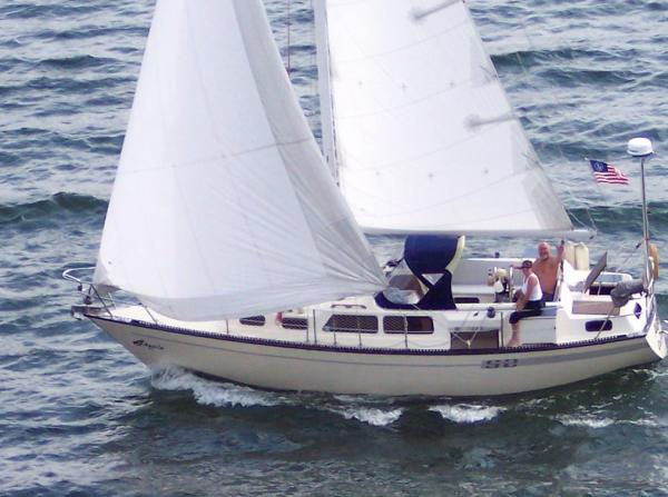 s/v AQUILA underway with a wave from the crew.