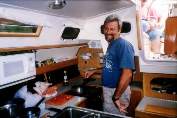 Sailing 2001 33 George K preparing dinner in the galley