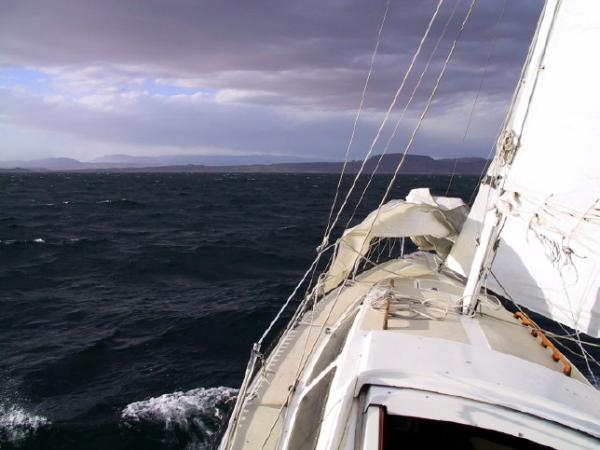 Sailing into a front. With a sudden increase in the wind, I simply dropped the outer jib onto the deck, and left the inner jib up.