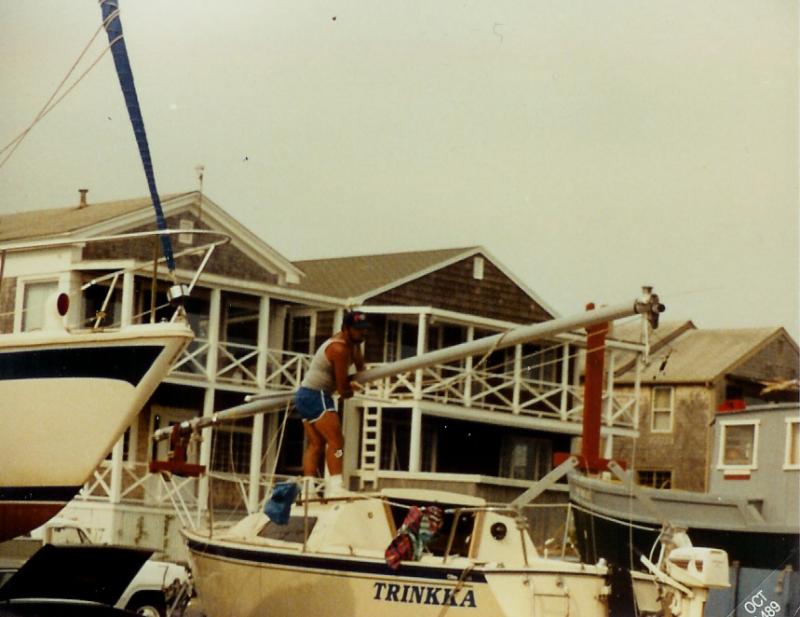 scan This is what I started out with years ago.  I used plywood, 2x4s, and some Aluminum bars along with two sub station transformer bushings to hold it to the stern rail.  The mast crutch fit into a rabbet groove and I could slide it up or down.