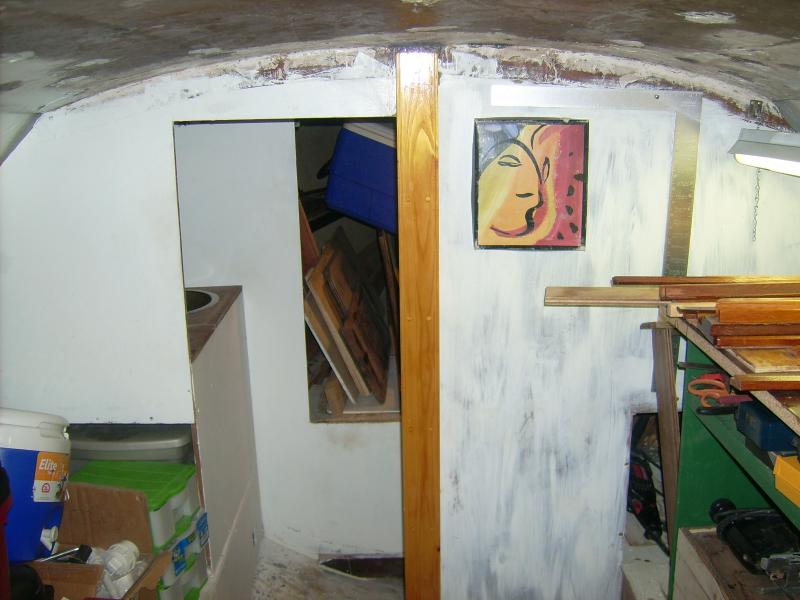 September 2011.  Diana's main cabin, showing my 'temporary' workbench standing in the settee and the new compression post.  The 'Picasso' on the bulkhead is a shoebox lid  :)