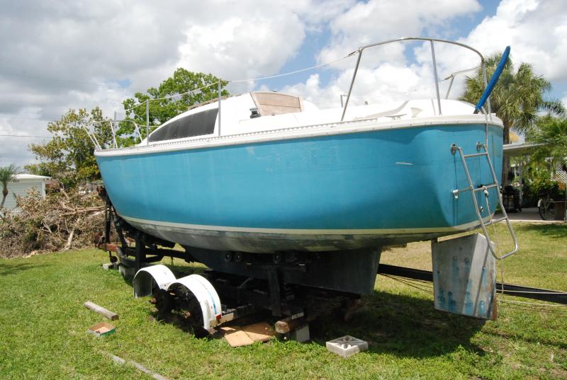 She hasn't moved in God knows how long. Getting her ready to go. I have a Ford F150 and thought i might need an f250 4x4 to pull her out but was pleasantly surprised when i let the tung down on my hitch, the trailer only brought my truck down couple of inches. The boat was nicely balanced on the trailer. I pulled her home the 40 miles without much trouble, nice and slow. Hooked up some temp lights and away we went.