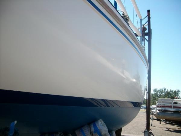 Side is so shiny you can see the boat sitting next to it in reflection
