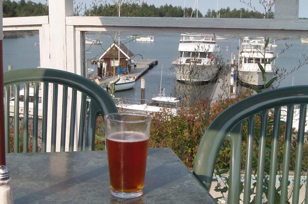 Silva Bay, Gabriola Island B.C.   Tasty beer and Pakele below on the dock Aug 2009 enroute to Desolation Sound - The large yacht in the photo had automatic sliding glass doors and a waitstaff.