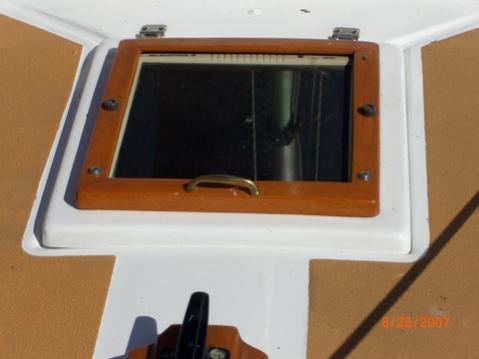 Solar Panel on Foredeck Hatch -- this is a 5W panel that I have since replaced with a 10W of about the same physical dimensions