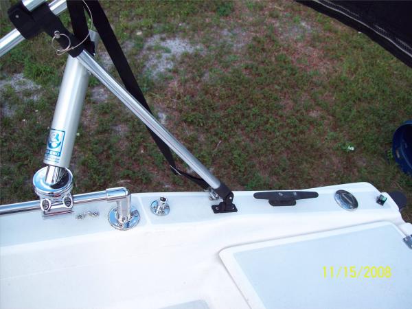 Starboard. Rod holder. BBQ mount.  Filler for 11.5 fuel tank installed in laz.  We use 3-gal tanks except for trips such as Bimini.  Who needs those gas prices!