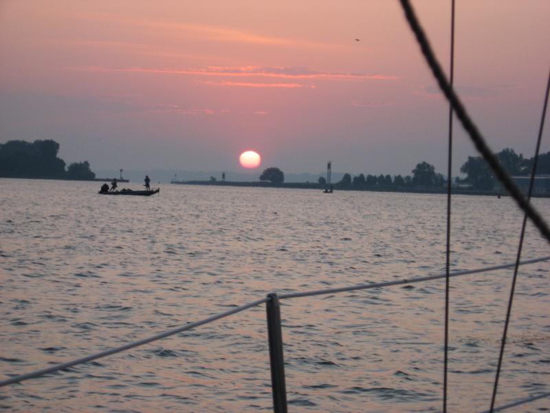 Sun rise out bound Erie bay