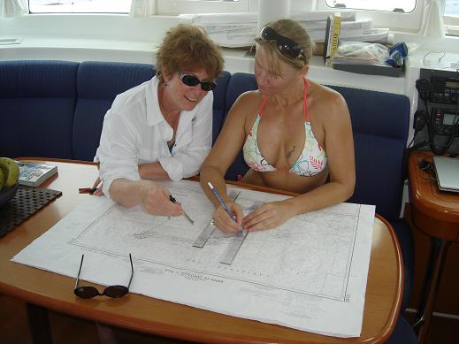 Susan and Sister Suzan ploting the course from Roatan to Utila