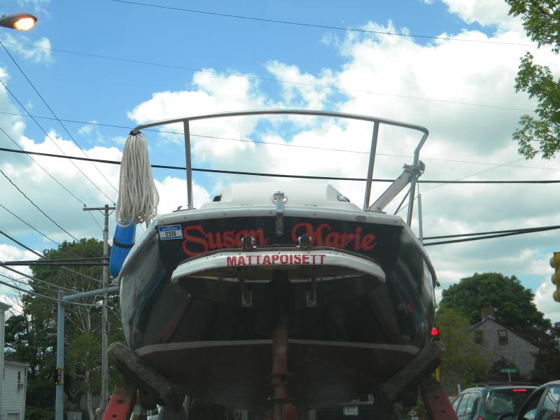 Susan Marie showing off her new Teak swim platform. If you look right below the swim platform, you can see the modification to the Transom and Motor well which now allows the outboard to be tilted out of the water.