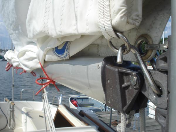 Tack edge of the sail reefed.