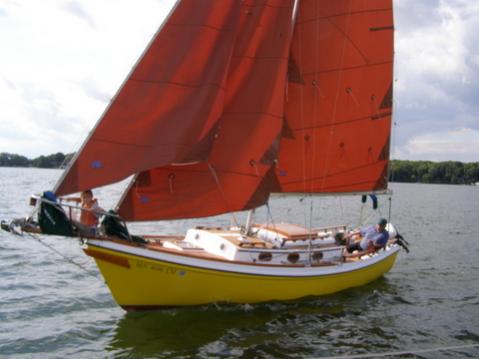 Taken from a 26M as I passed her.  The jib is luffing because I'm trying to slow down so we could chat.  Note Devon riding the bowsprit