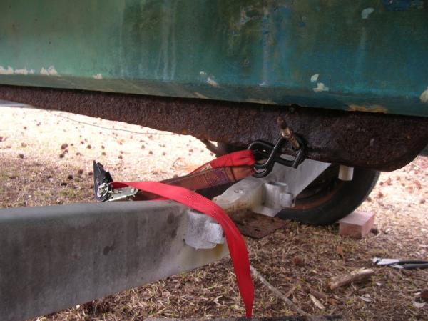 Talk about a pain in the neck.  The swing keel was rusted in the up position.  Also in the process of drilling through the 1/4 inch steel, the drill bound up sending my head into the bottom of the boat.  Hurt like hell...