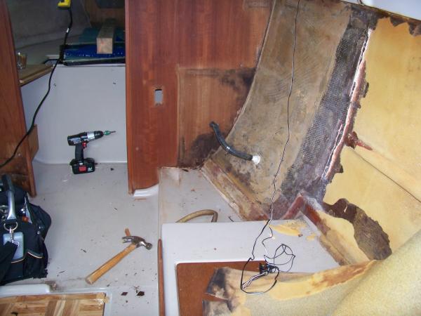 The beginning of tearing out the inside. More pix are posted in threads such as &quot;sea trek: trouble with tabernacles&quot;, &quot;that sinking feelin'..trouble with compression post&quot;, and &quot;cutta hole in my boat&quot;