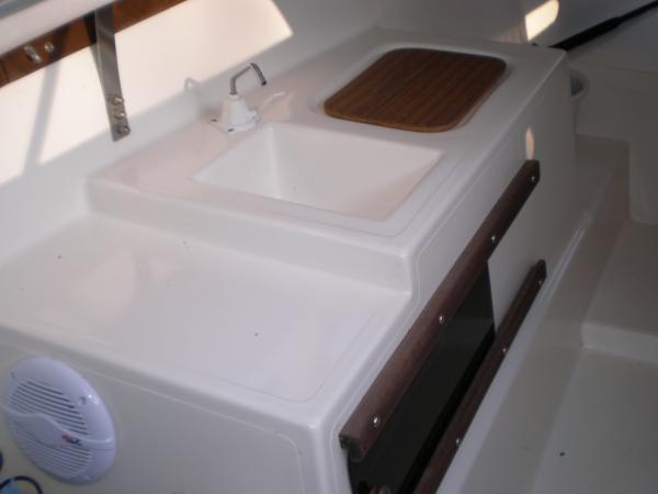 The &quot;kitchen&quot;.  Counter, sink, ice box and storage below.