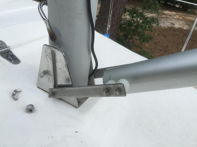 The two external SS plates can be safely removed after stepping the mast. I have not see this solution elsewhere but it works well. A first attempt with aluminum plates instead of of the SS was marginally successful as the larger size made the removal the gin pole after the operation somewhat difficult.