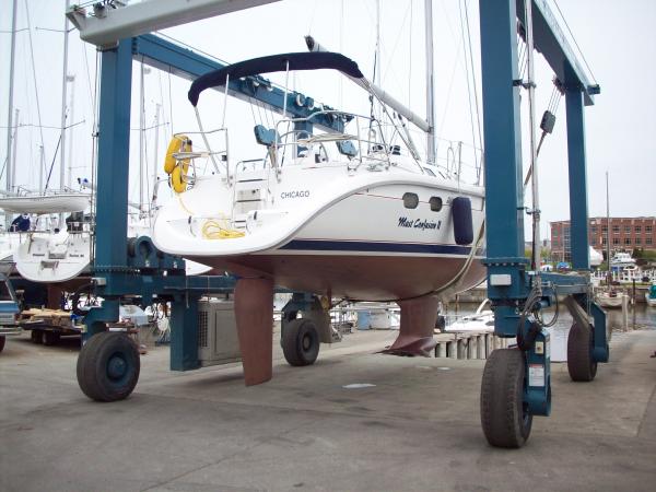 These are shoot of Mast Confusion II splashing for the 2008 sailing season in Racine, WI.  See the new bottom paint not back I am thinking.