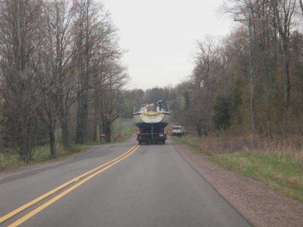 This happens every spring and fall. We haul Blew Inn 15 miles each way to put her in the pole barn at home or in the slip at Cinder Pond Marina, Marquette Mi