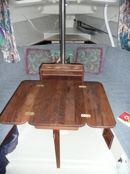 This is a teak cockpit table made by AFI\Marinco. Will seat 4 when the neighbors come over.
