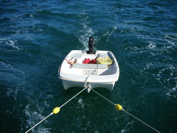 This is our cheapie dink that gets towed all over and for which we had custom cushions made that cost more than the dink itself!