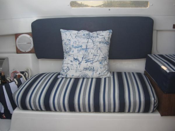 This is the port side seat. We split the posrt side seating  hung the backrest on the wall. This was much more comfortable and kepth everything ater a day of sailing.(pics of the mounting are included.)