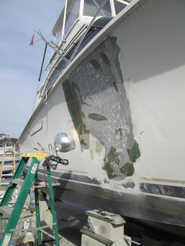 This is the side of an Ocean 38 convertible (sportfishing/cruising model), holed by Storm Sandy and crudely/hastily patched up, still in the water, in order to come down from Atlantic Highlands to Forked River on her own bottom.  I got the job of filling and fairing the patch, which was a bigger job than the owner expected because it's a cored hull being filled without core.  And there is water in the core, typical of mass-produced cored hulls anyway and undoubtedly made worse by the storm damage.  Not long after I informed him of that, he decided he didn't need my services.  I find this sadly typical of powerboat owners-- if it's not related to fishing or engines, they don't understand it and won't spend the money on it.

This is why guys like me are so often out of work; and why I won't ever do contract work for powerboat owners again.

1 Feb 2014