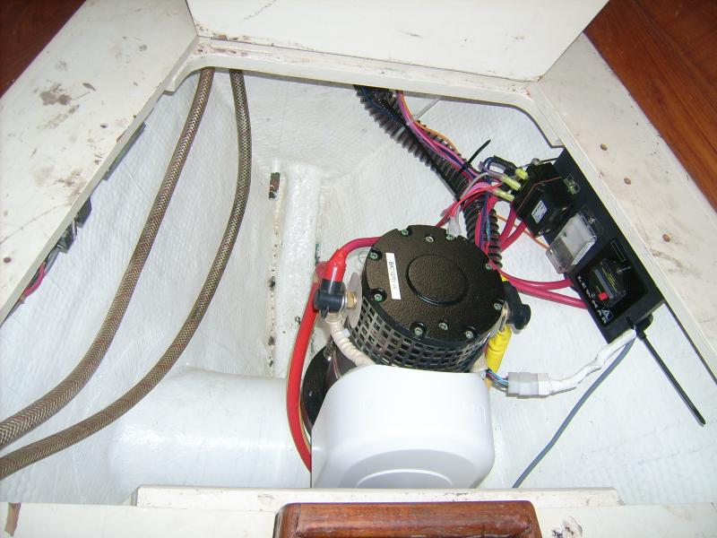 This is the tidy installation of Lewmar bow-thruster motor Lee and I did here.  Lee, the once and future 'glass king', did a marvelous job tabbing in the tube down there.  I don't have the patience for that!

The moldy hoses are original to the 1982 commissioning and we weren't tasked with replacing them.

11 May 2012