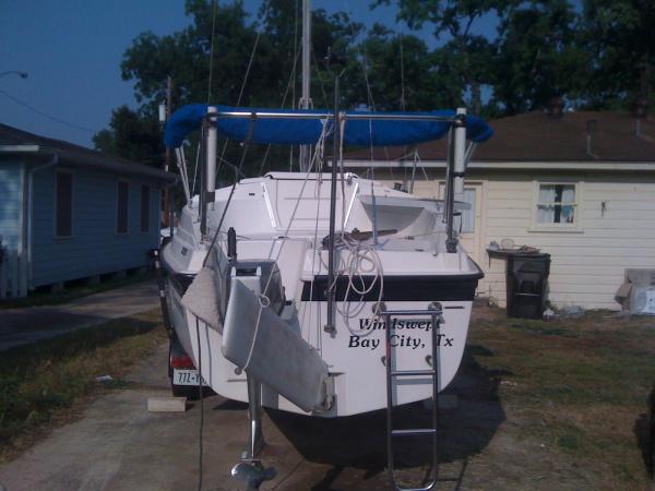 Trying out fishing rod holder placement.
 They are out of the way, but hard to see when under way with the bimini up.