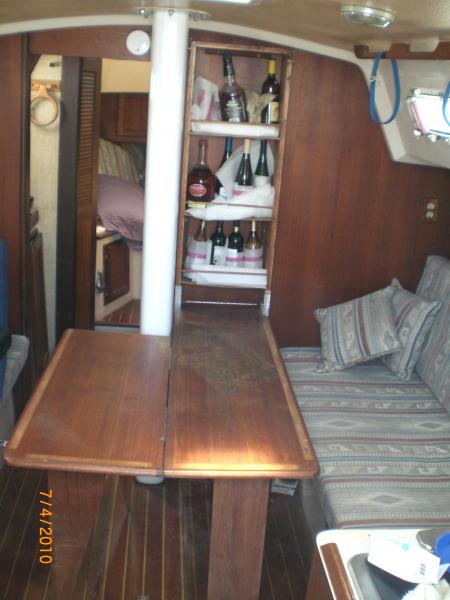 Wall mounted table and liquor cabinet open