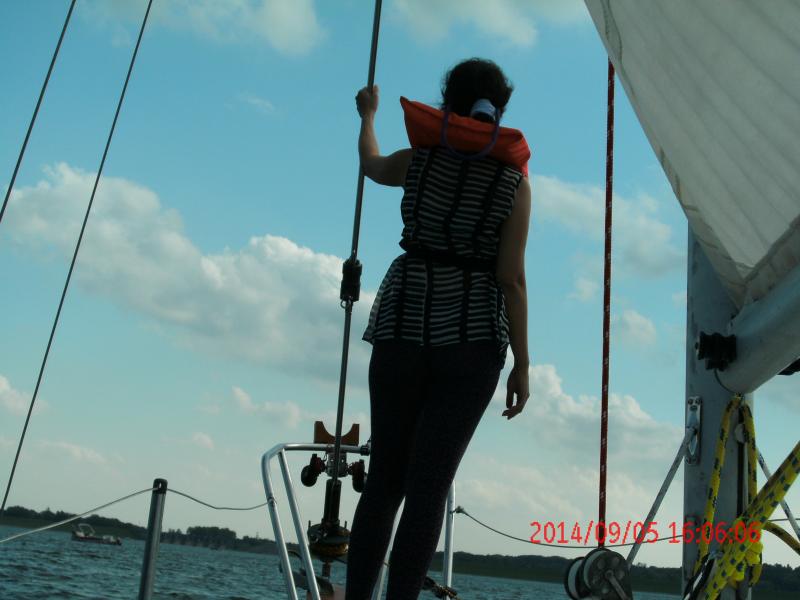 wife 1st time on sailboat, riding the waves on the bow