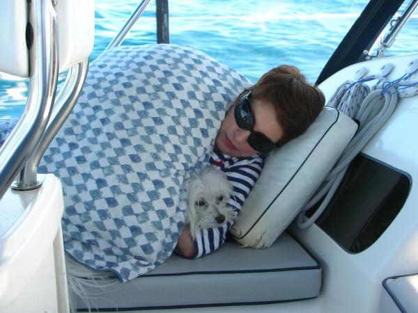 Wife Marlyn and Sailor all cuddled up just before they both retired below to sleep in the aft cabin.
