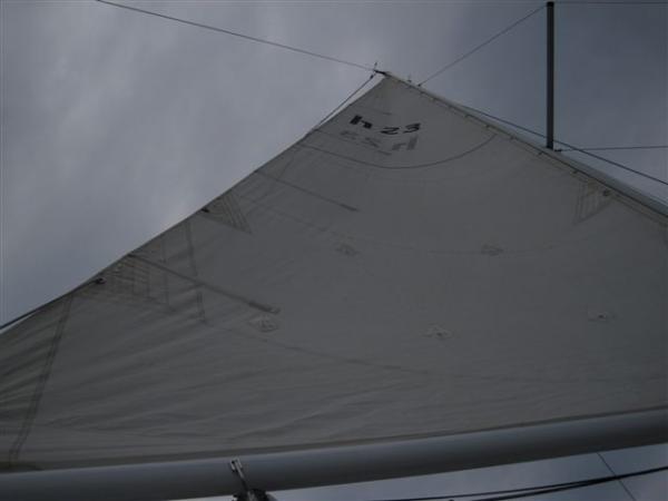 windward side of mainsail, light wind at dock, taken from cockpit floor